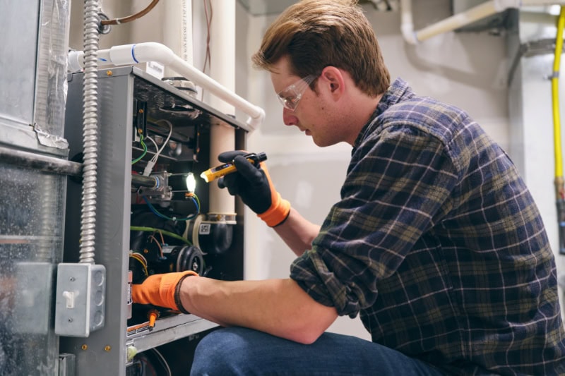 Technician working on Unit.